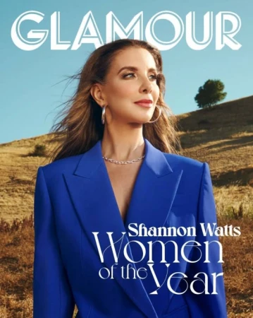 Glamour magazine cover featuring Shannon Watts. The shot is outdoors, with Watts wearing a blue suit jacket and jewelry.