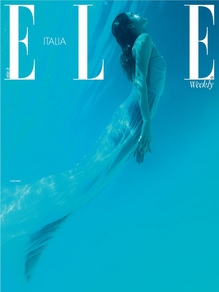 Elle Italia magazine cover featuring a woman in a light dress underwater, captured in a portrait orientation with blue tones.