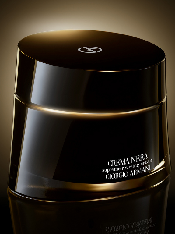 Close-up studio shot of black and gold Crema Nera Supreme Reviving Cream by Giorgio Armani, product shot, skincare, cosmetics.