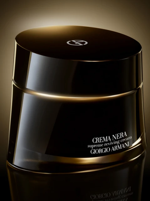 Close-up studio shot of black and gold Crema Nera Supreme Reviving Cream by Giorgio Armani, product shot, skincare, cosmetics.