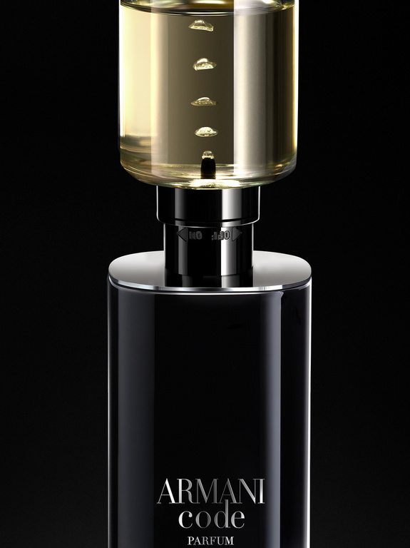 Studio shot of a black Giorgio Armani Code Parfum bottle with a clear top, showcasing the fragrance against a dark background.