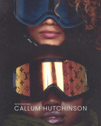 Close-up portrait of two individuals wearing large designer ski goggles with reflective monogram lenses, photographed by Callum Walker Hutchinson