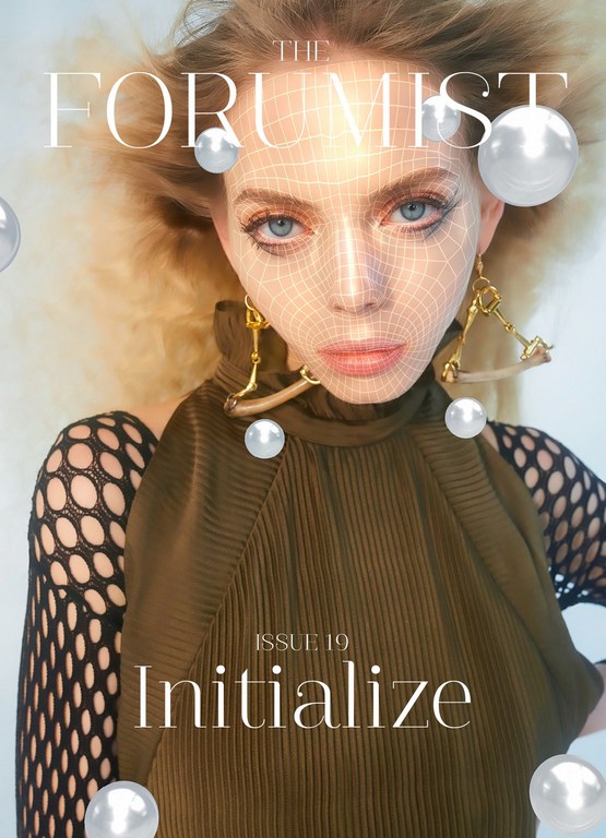 Magazine cover featuring a female model with blonde hair, wearing a green top, gold earrings, and pearls with a digital grid overlay.
