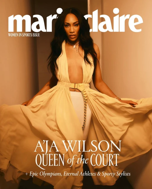 Aja Wilson on the cover of Marie Claire's Women In Sports issue, wearing a flowing dress with white pants, in a studio setting.