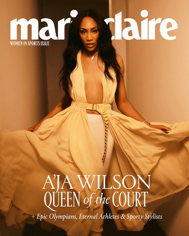 Magazine cover featuring A'ja Wilson in a flowing yellow dress. "Marie Claire" title, "Women in Sports Issue." Close-up shot indoors.