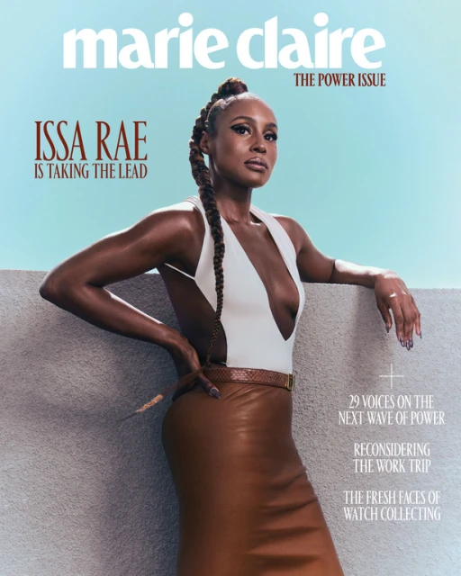 Issa Rae on the cover of Marie Claire's 'The Power Issue', posing in a white top and brown leather skirt against a blue sky backdrop.