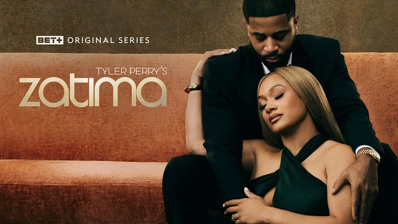 TV show poster: Two adults on an orange couch. The man in a black suit hugs the woman in a green dress. Title text reads 'Zatima'.