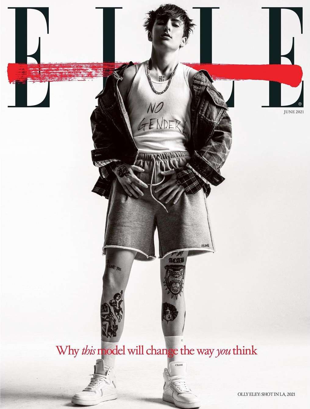 Magazine cover featuring a person in casual wear with visible tattoos, styled with a jacket, shorts, tank top, and sneakers against a clean backdrop.