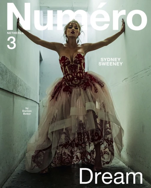 Sydney Sweeney on the cover of Numero Netherlands 3, wearing a strapless red and pink tulle dress, posing in a narrow hallway.