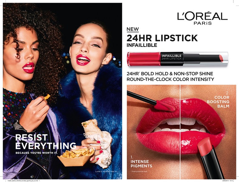 Two women pose with red lipstick in a beauty ad for L'Oréal Infallible 24HR Lipstick, showcasing vibrant color and long-lasting shine.