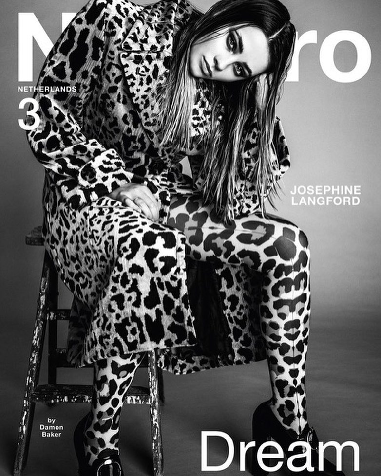 Josephine Langford poses in a leopard-print coat and leggings on a stool, in a black-and-white fashion magazine cover photo.