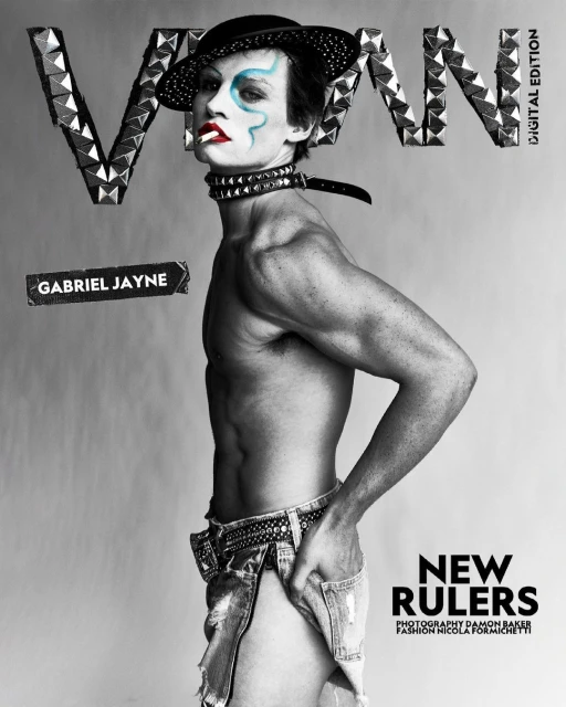 Black-and-white fashion shot featuring a shirtless male model with painted face and hat, posing in ripped jeans with a cigarette.