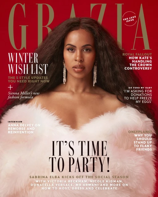 Sabrina Elba graces the cover of Grazia magazine, posing in a faux fur stole against a red background with cover text.