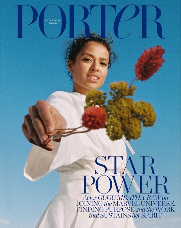 Fashion magazine cover featuring Gugu Mbatha-Raw in a white dress, holding flowers against a clear blue sky with magazine text overlay.