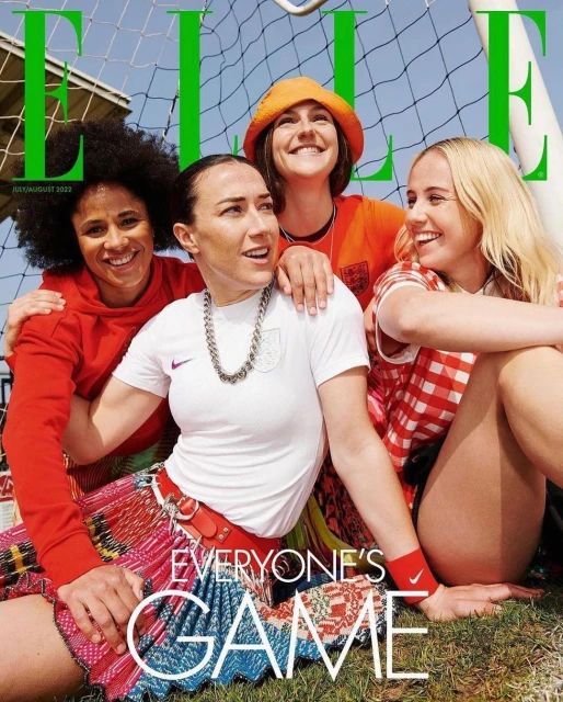 Elle magazine cover with four smiling women in colourful sporty outfits. They pose in front of a soccer goal with a blurred blue sky.