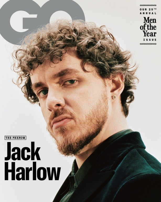 Close-up magazine cover featuring Jack Harlow with curly hair, a dark jacket, and text overlay on a light background.