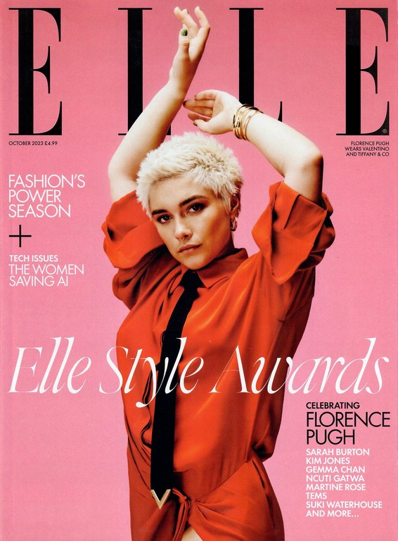 Elle magazine cover featuring Florence Pugh in an orange dress with hands raised, against a pink background with masthead and text.