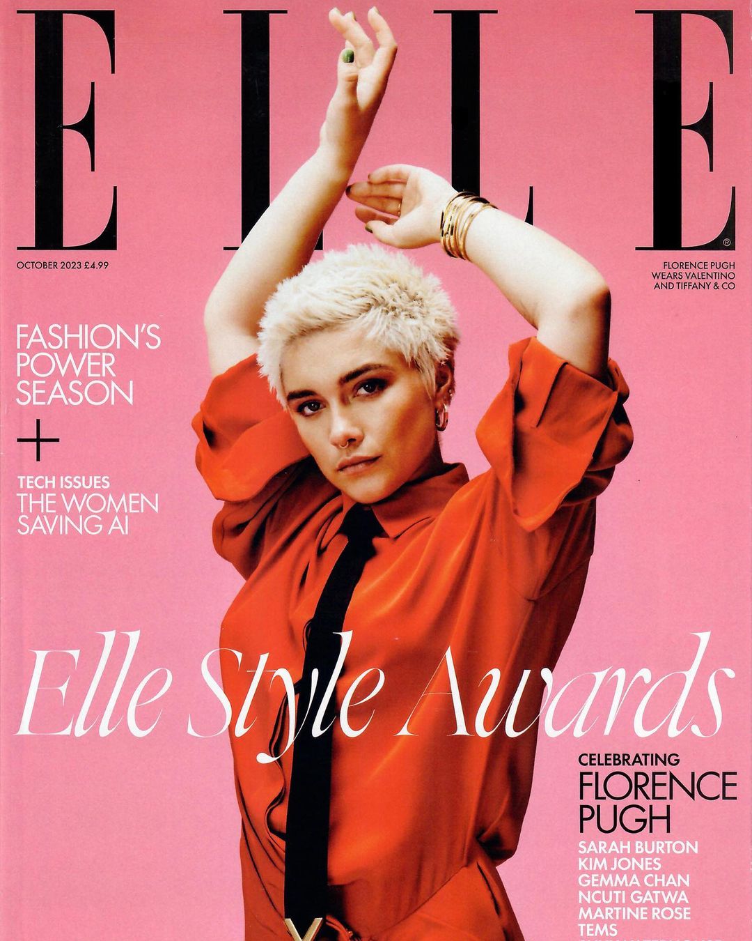 Elle magazine cover featuring Florence Pugh in an orange shirt and black tie against a pink background with magazine text and details.
