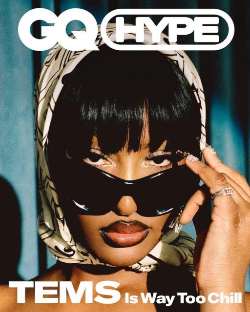 Close-up fashion magazine cover featuring an African-American woman wearing sunglasses and a patterned headscarf, with bold magazine text.