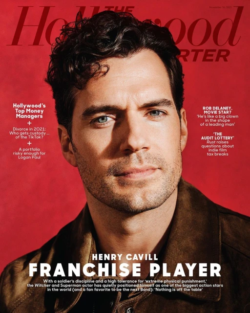 Henry Cavill on The Hollywood Reporter cover, wearing a brown jacket against a red background. Magazine features articles on Hollywood money managers.