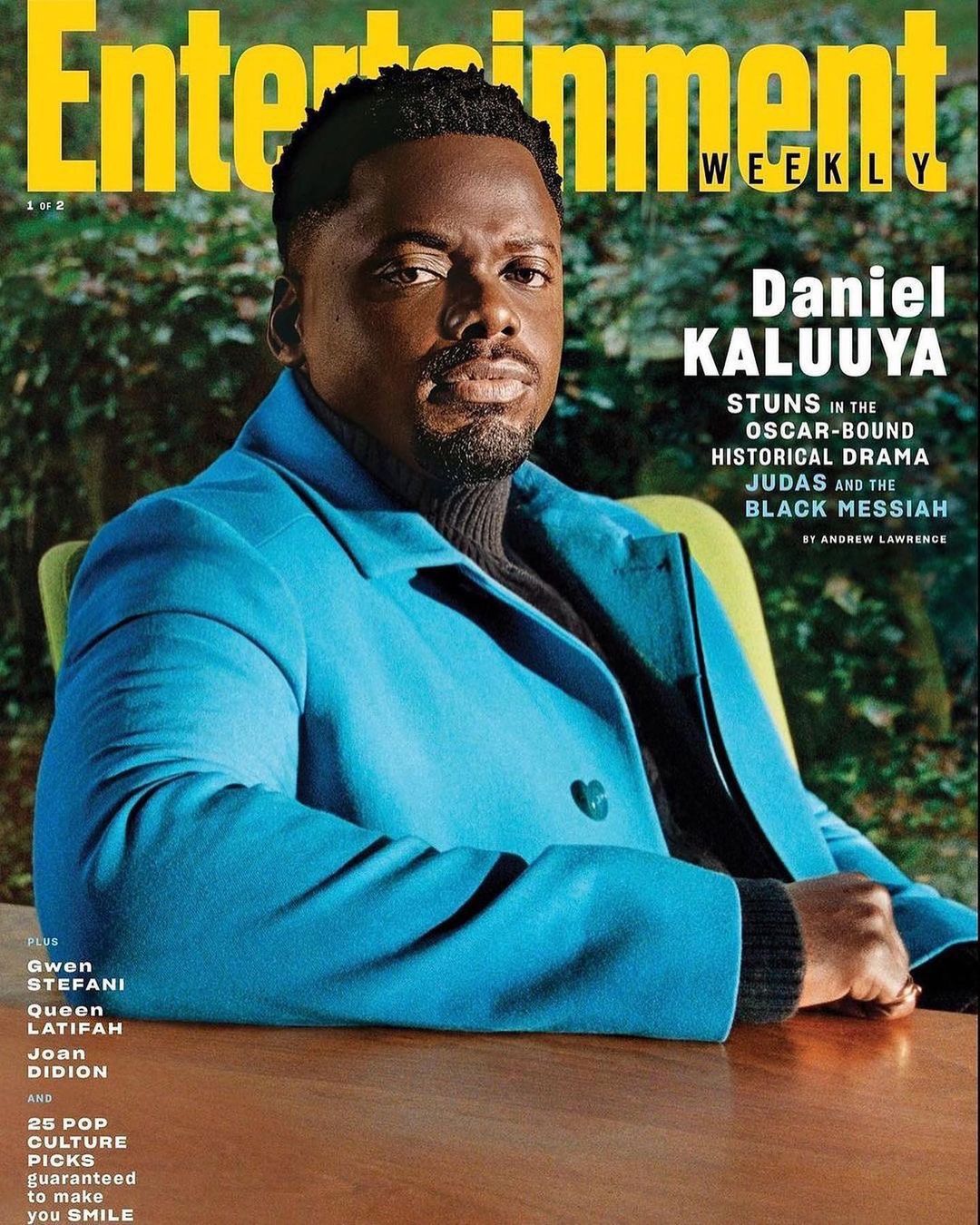 Entertainment Weekly cover featuring Daniel Kaluuya wearing a blue coat, sitting at a wooden table in front of a green background.