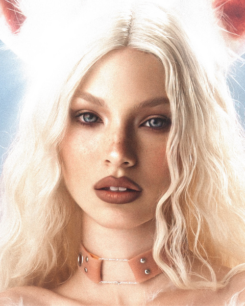 Close-up portrait of a young adult woman with fair skin, platinum blonde hair, and rabbit ears, wearing a pink collar necklace.
