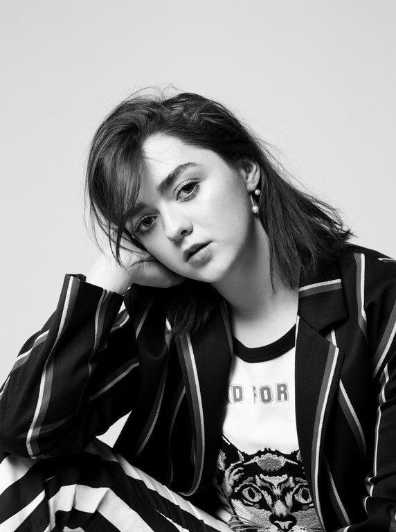 Portrait of Maisie Williams in a striped suit and graphic t-shirt by photographer Kerry Hallihan