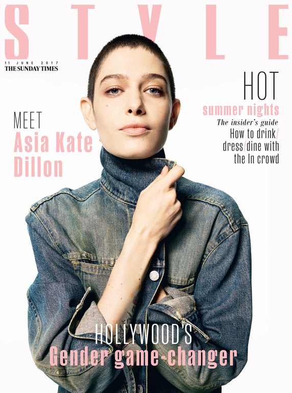 Magazine cover featuring Asia Kate Dillon, an adult, wearing a denim jacket and turtleneck top against a white backdrop with pink text.