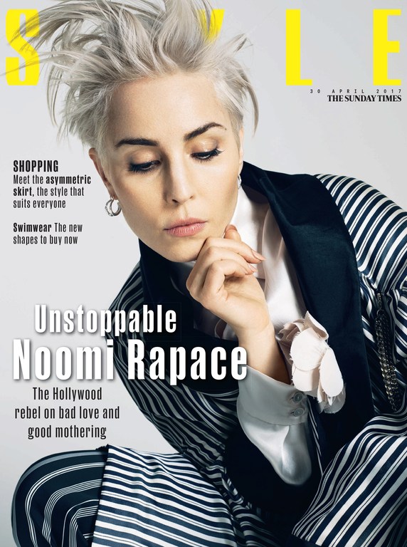 Magazine cover featuring Noomi Rapace in striped suit. Text includes 'Unstoppable Noomi Rapace', 'The Sunday Times', and shopping guide.