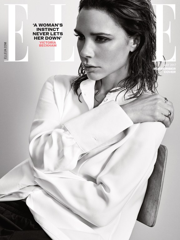 Black and white portrait of Victoria Beckham on ELLE magazine cover with wet hair, wearing a white shirt, against a light gray background.