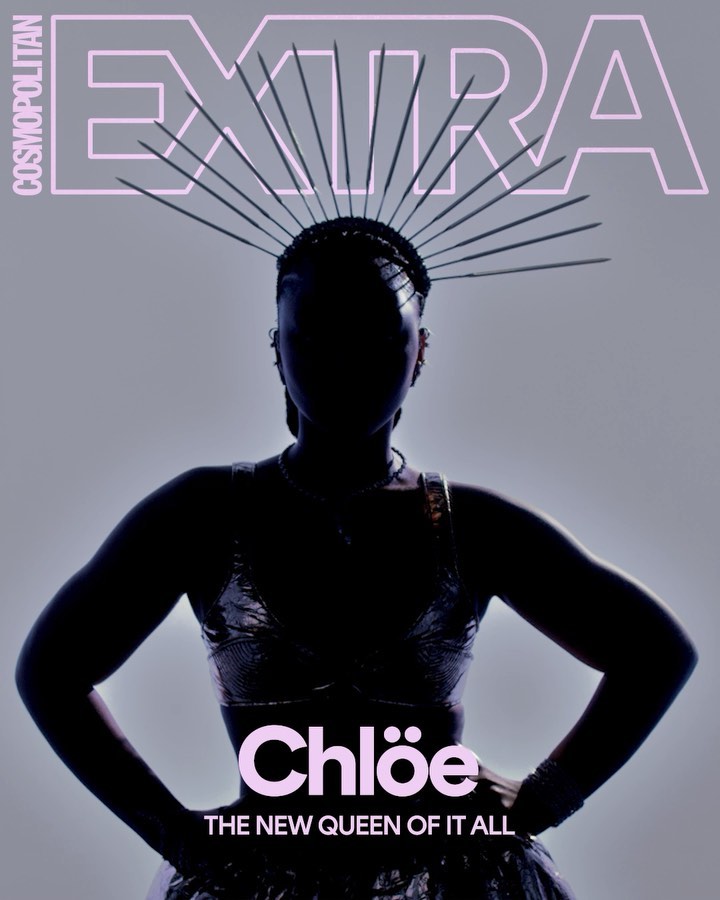 Cosmopolitan EXTRA cover featuring a silhouetted figure of a woman wearing a spiky halo-like headpiece, hands on hips, against grey backdrop.