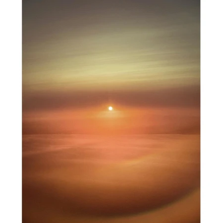 Vibrant orange sunset over the ocean horizon, reflecting on the calm water in a serene seascape.