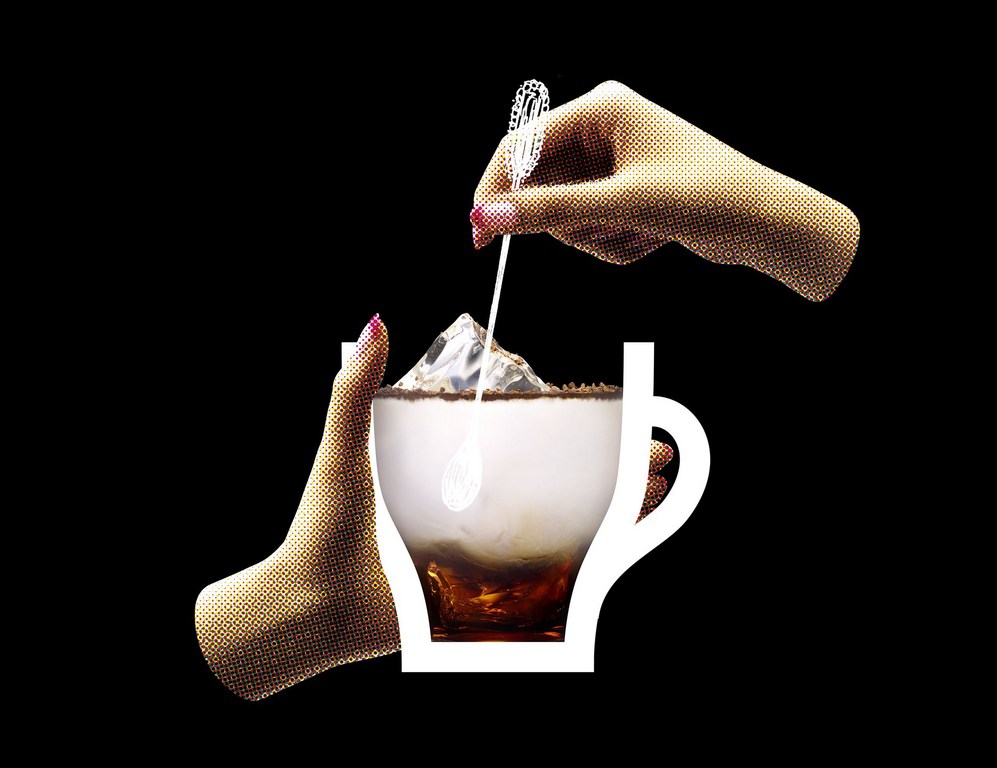 A graphic image features two hands stirring a drink in a white graphic mug with an ice cube, set against a black background.