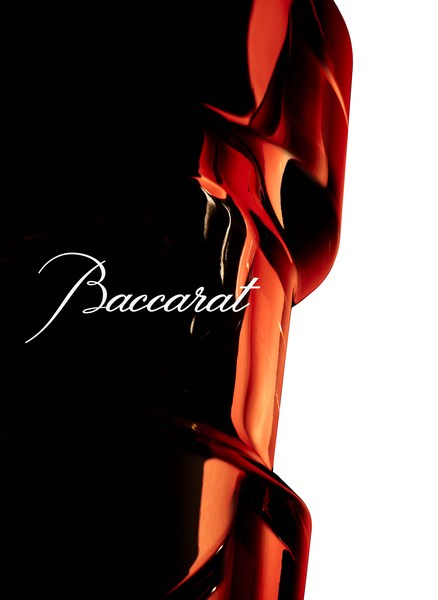 Elegant Baccarat crystal object on a stark black and white backdrop with signature logo, showcasing its form and luxury appeal.