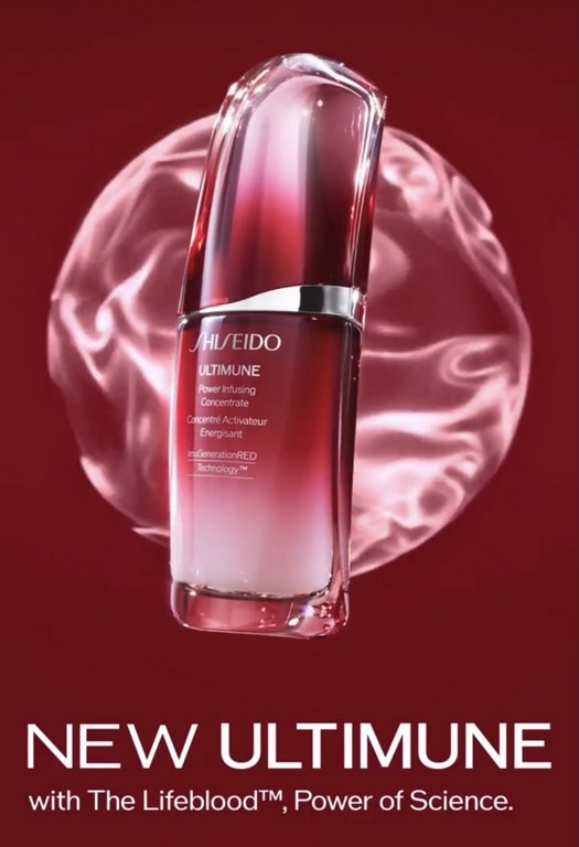 Shiseido Ultimune Power Infusing Concentrate bottle on a red background with a translucent sphere behind it for beauty advertising.
