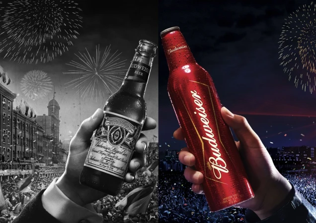 Dual-toned Budweiser ad featuring a classic bottle in monochrome alongside a red aluminum bottle, celebrating heritage and modernity.