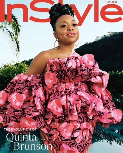 Magazine cover featuring Quinta Brunson in a large pink floral dress, posing outdoors against a blurred background of trees and water.