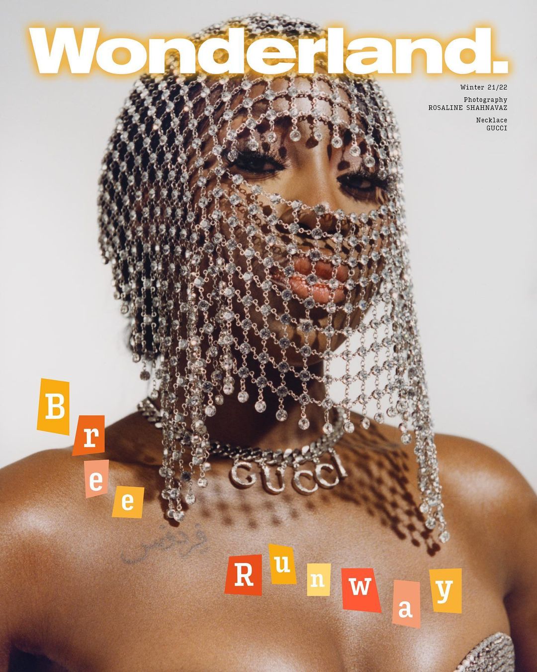 Wonderland Magazine cover featuring a Black female model with a silver mesh headpiece and Gucci necklace on a white background.