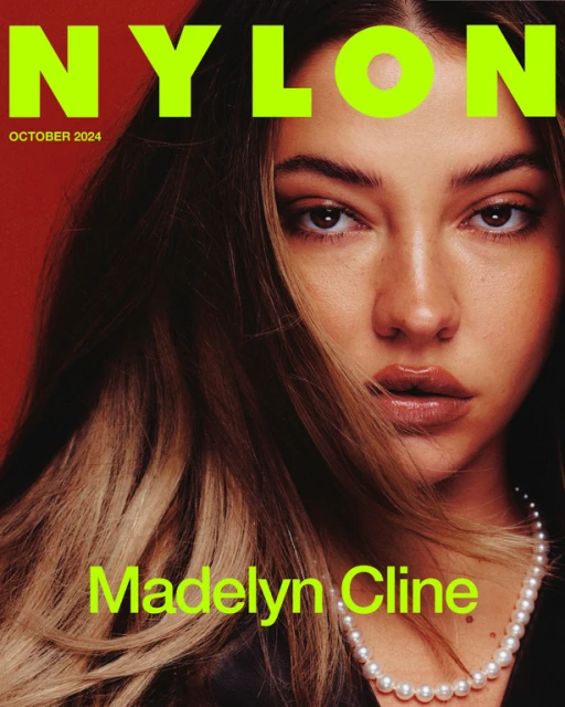 Close-up cover shot of Madelyn Cline on Nylon magazine, October 2024 issue. The actress wears a pearl necklace and poses on red background.