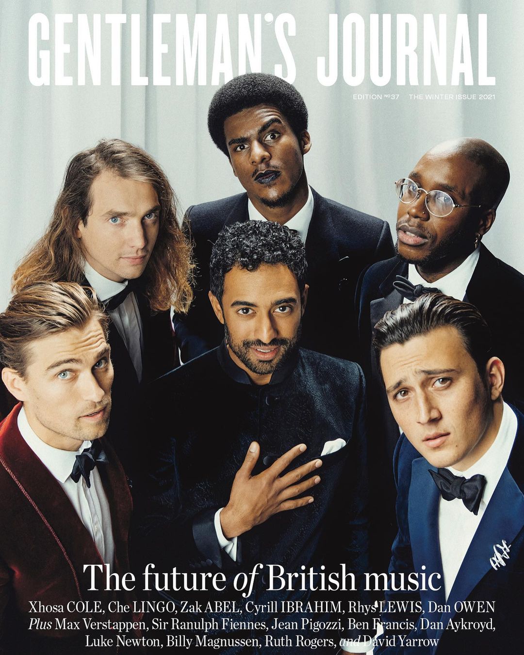 Magazine cover shot of six multi-ethnic men in formal wear looking at the camera, against a light neutral backdrop with gray tints.