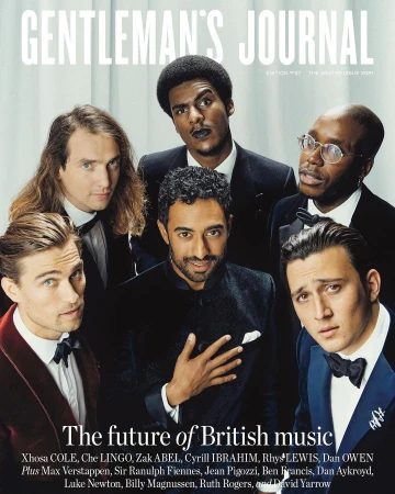 Magazine cover shot of six multi-ethnic men in formal wear looking at the camera, against a light neutral backdrop with gray tints.