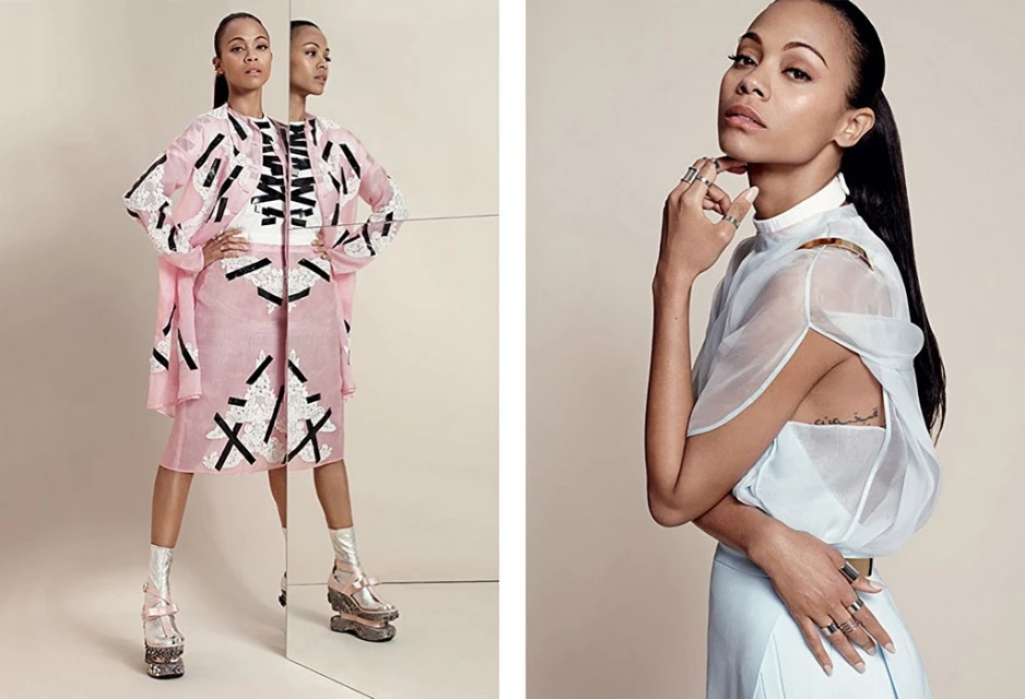 Fashion editorial shot of Zoe Saldana wearing designer dresses and platform heels, posing in a light studio with mirrors and neutral backdrop.