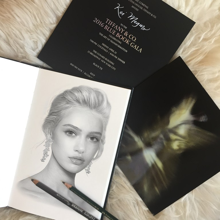 Drawing of a fair-skinned woman with chandelier earrings in a sketchbook with TIFFANY & CO. invitation and art photography.
