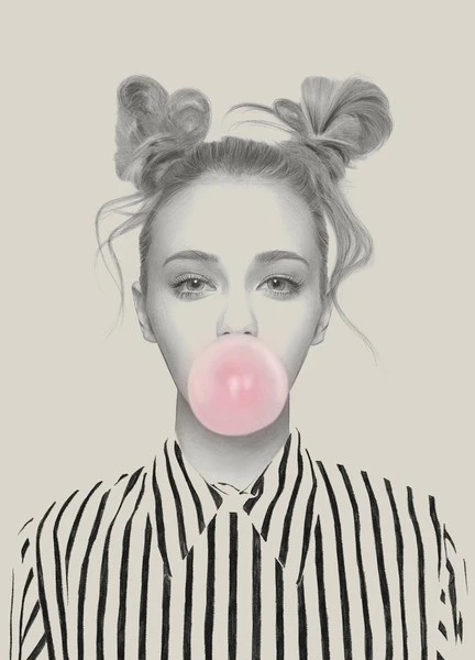 Eye-level close-up portrait of a young woman blowing a pink bubble with her hair in space buns and wearing a striped shirt against a beige background.