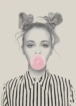 Eye-level close-up portrait of a young woman blowing a pink bubble with her hair in space buns and wearing a striped shirt against a beige background.