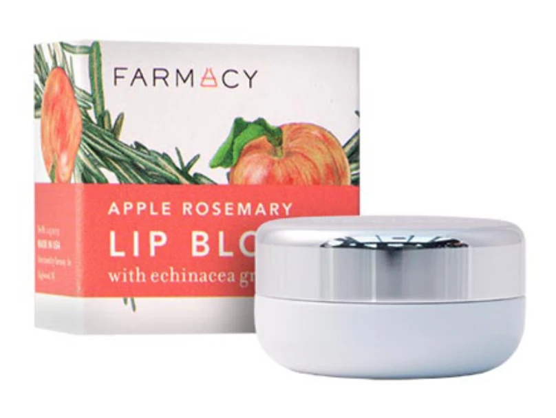 Farmacy Apple Rosemary lip balm in container and product box, white container with silver lid, red and white box.