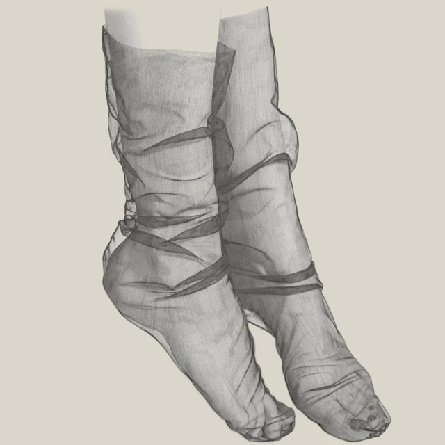 Close-up of two legs adorned with sheer, dark gray socks, showcasing the fabric's delicate texture and form-fitting design against a neutral backdrop.