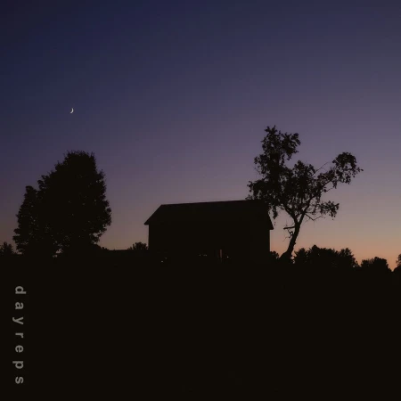 Silhouette of a barn and trees against a dusk sky with a crescent moon by Allie and Jesse