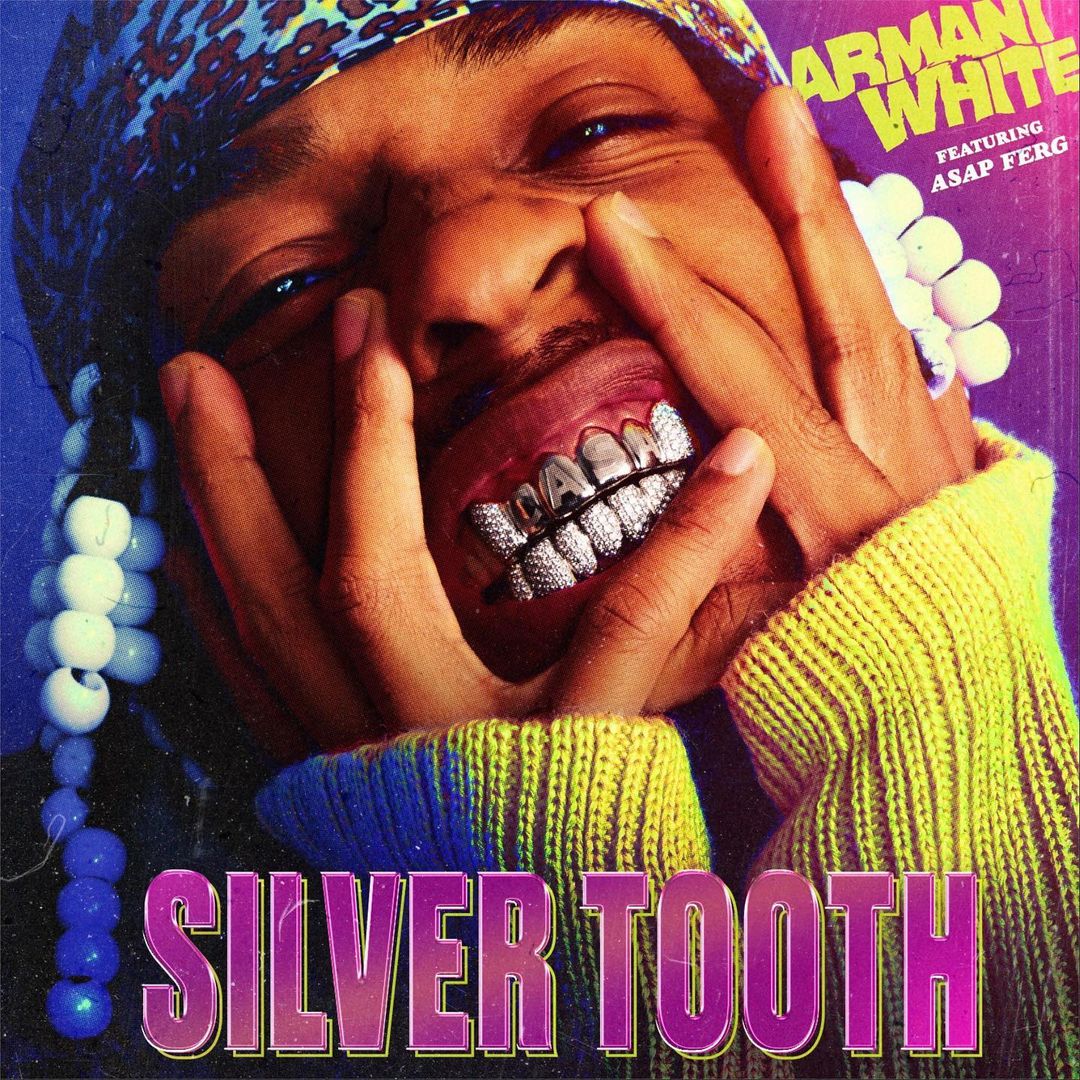 Music album cover featuring a young African American man with silver teeth, holding his face. Bright colors and bold text are prominent.