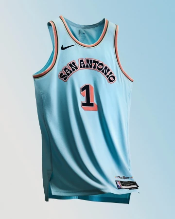San Antonio Spurs #1 jersey displayed on light blue background. Basketball apparel with team logo and number on the front.